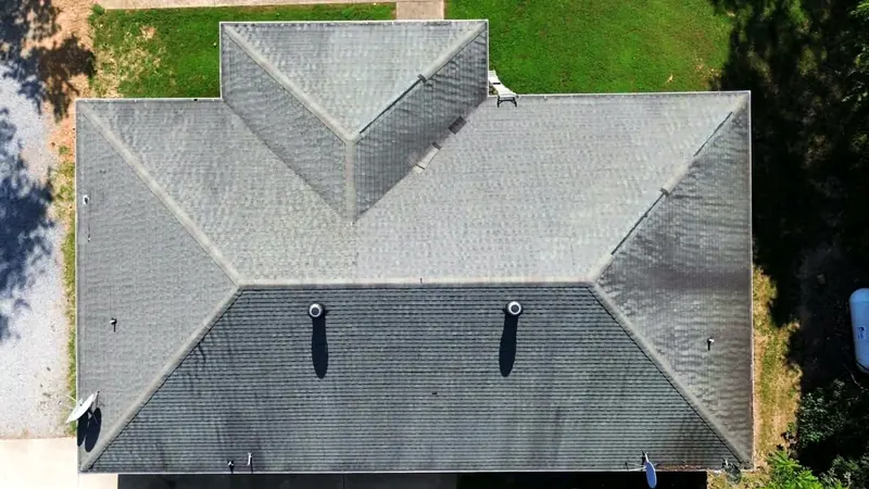 Hip roof before, with worn and faded shingles