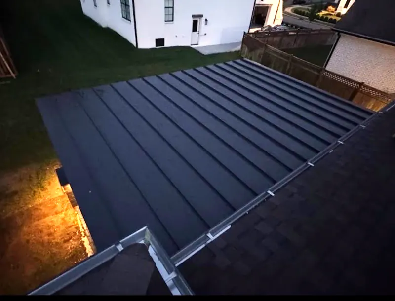 Same pergola from above with the finished black standing seam roof