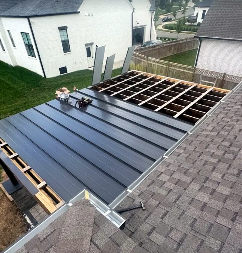 Black metal panels going on the pergola frame