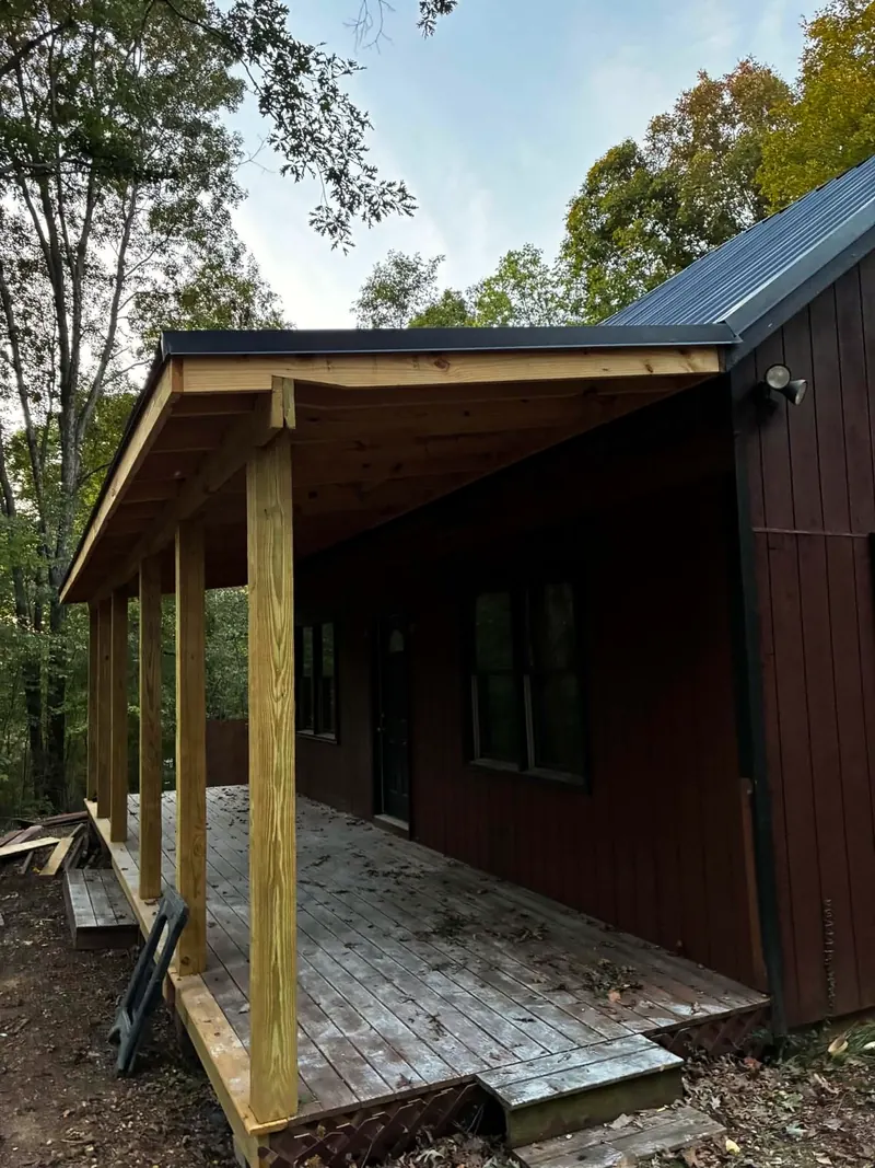 New covered porch on the side of the cabin